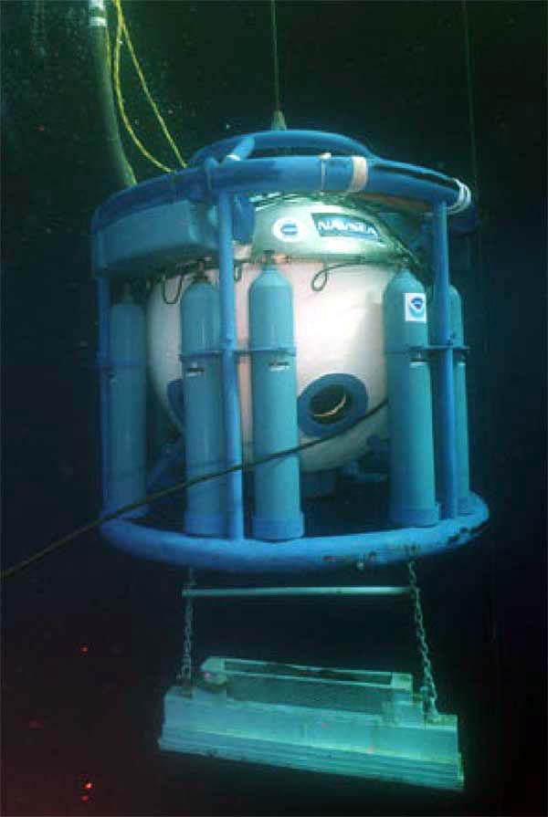 The SAT system diving bell is raised to the surface