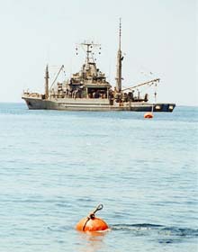 USS Grapple moored to buoy