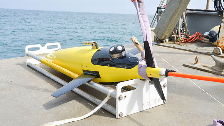 Seaglider, an autonomous underwater vehicle, is outfitted with an acoustic Doppler current profiler (ADCP) and prepared for deployment during the Coordinated Simultaneous Physical-Biological Sampling Using ADCP-Equipped Ocean Gliders expedition.