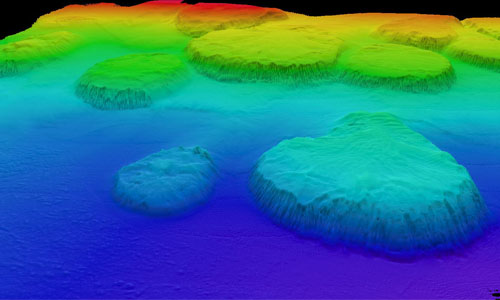 In 2012, NOAA Ocean Exploration mapped these salt domes in the Gulf of Mexico. Salt domes are formed when mounds or columns of salt beneath the seafloor push rocks and sediments above them upward into hill-like structures that rise from the seafloor. Salt domes have been associated with oil and gas seeps as well as a variety of marine life, including chemosynthetic communities, making them  important features to locate and document.