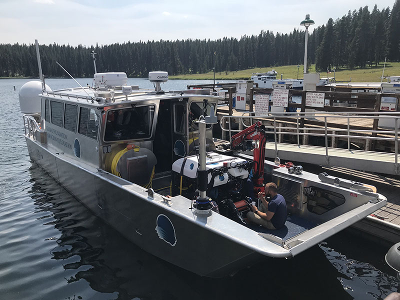 An engineer prepares the Global Foundation for Ocean Exploration’s remotely operated vehicle Yogi for a dive on their Research Vessel Annie in Yellowstone National Park’s Yellowstone Lake.