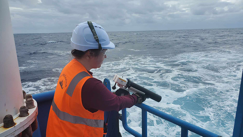 Amanda Finn deploys an XBT or expendable bathythermograph during a voyage on Research Vessel Investigator. These small torpedo-shaped probes are used to collect ocean temperature data, generating temperature profiles that play an important role in multibeam mapping operations.