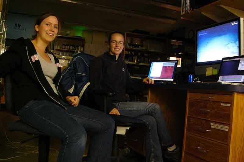 Volunteer intern, Catriona Munro, and summer fellow, Elizabeth Sibert, take part in the INDEX-SATAL 2010 expedition from Woods Hole Oceanographic Institution (Woods Hole, Massachusetts). The team accessed <em>Okeanos Explorer</em>'s video feed via Internet 2 and communicated with scientists ashore and at sea via a conference call and utilization of a real-time, text-based collaboration tool referred to as the 'Eventlog' (essentially a group chat room).