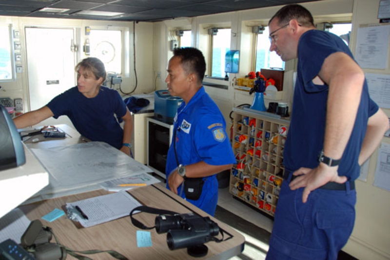 Operations Officer Nicola VerPlanck discusses the ship's position with Major Muddan Zayadi and Commanding Officer Joe Pica on the bridge. Soon after Major Muddan confirmed that data collection could commence, INDEX-SATAL 2010 was underway.