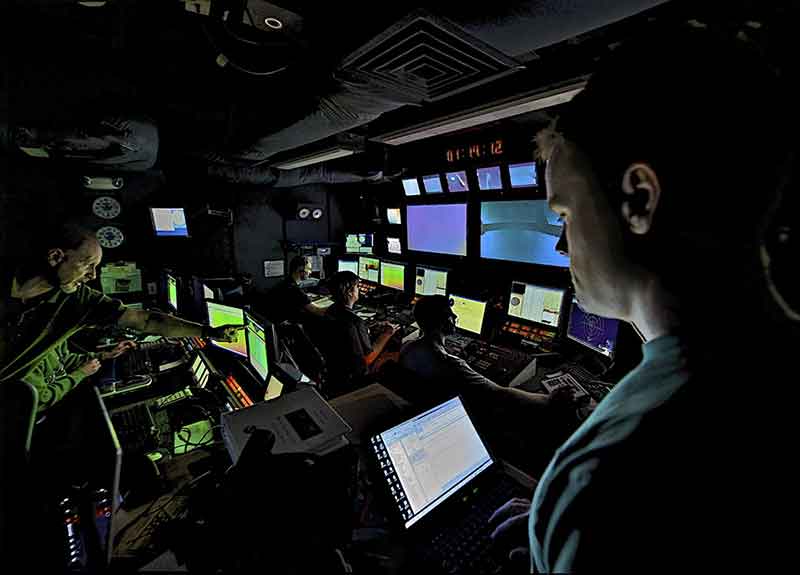 The ROV Navigator, Pilot and Co-Pilot monitor the vehicle and camera controls as the camera platform and ROV are recovered at the end of a dive. They are in constant communication with the deck in case there are any problems encountered during the operation.