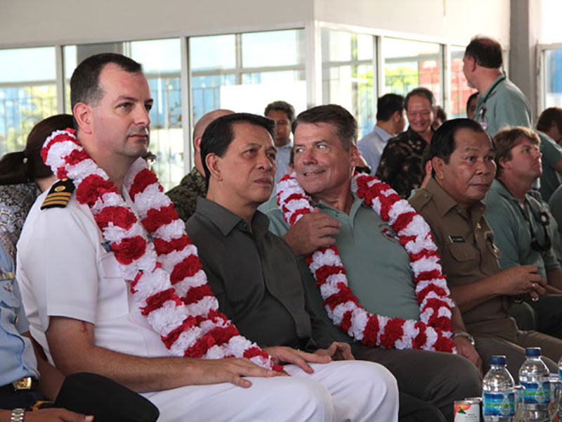 Commanding Officer Joe Pica, the Governor of North Sulawesi, U.S. Ambassador to Indonesia Cameron Hume, and the Mayor of Bitung await the beginning of the Welcoming Ceremony in the Port of Bitung.