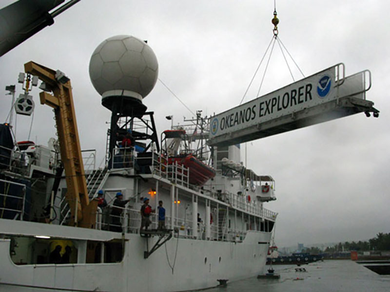NOAA Ship Okeanos Explorer’s gangway is lowered onto the dock in Bitung, Indonesia. This marked the first port of call during its maiden expedition in Indonesia.
