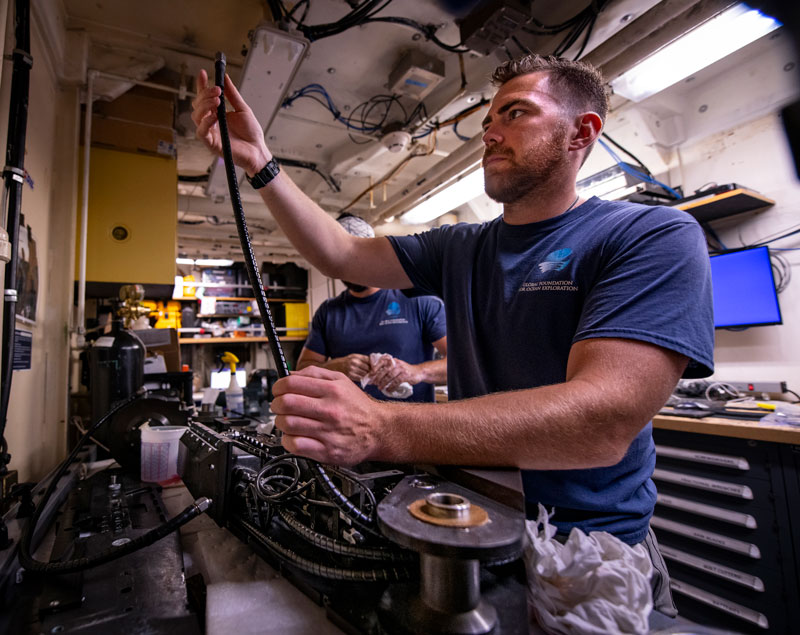 Lars Murphy, ocean/mechanical engineer with the Global Foundation for Ocean Exploration, works on remotely operated vehicle Deep Discoverer’s Kraft “Predator” manipulator arm during Voyage to the Ridge 2022 Expedition 2.