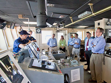 NOAA Corps officers on NOAA Ship Okeanos Explorer discuss operations with federal and state scientists and managers.