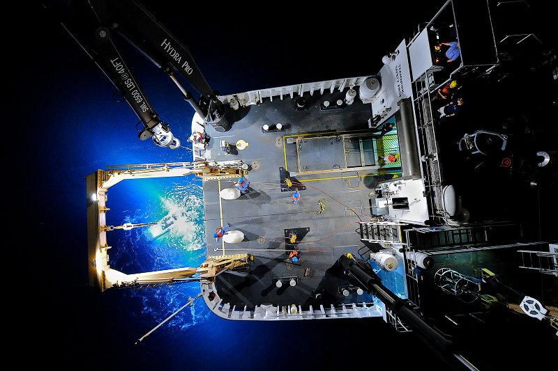 A unique down-looking view of a ROV recovery at night. The underwater glow is created by the powerful lights on the Seirios camera sled.