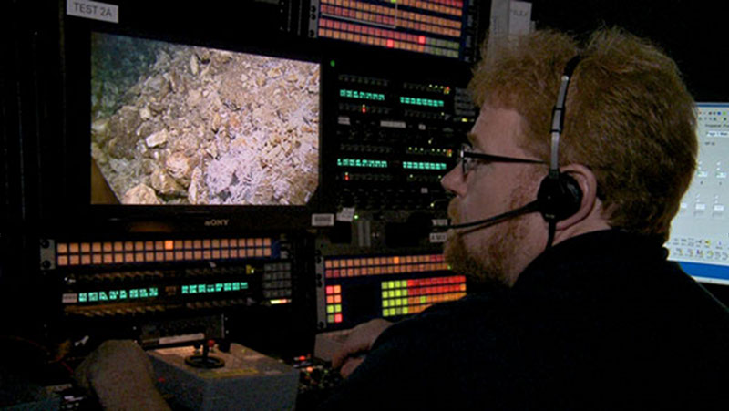 Video engineer Brian Brinckman adjusts the images from the HD camera on the remotely operated vehicle, Little Hercules.