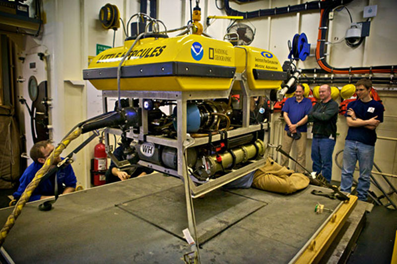 Off duty Mission Personnel gathered in the ROV Control Room to witness the first marker deployment from Little Herc. Little Herc successfully dropped a marker at a new location in Mississippi Canyon lease block 036.