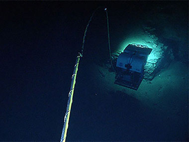 A view of the Deep Discoverer remotely operated vehicle (ROV) from the Seirios camera sled in Heezen Canyon, shows just how “up close and personal” the ROV can get to rock outcrops and associated biology.