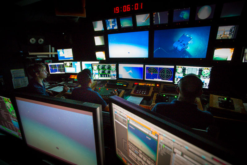 The control room of the Okeanos is as well coordinated as any live television studio. 