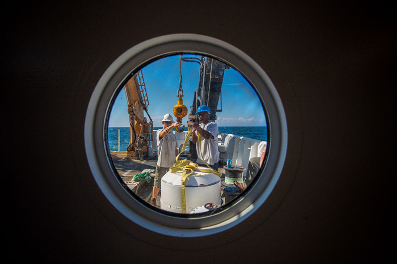 Crew members BGL Jerrod Hozendorf (left) and AB Kelson Bracey aboard NOAA Ship Okeanos Explorer prepare for the 2013 Northeast U.S. Canyons Expedition.