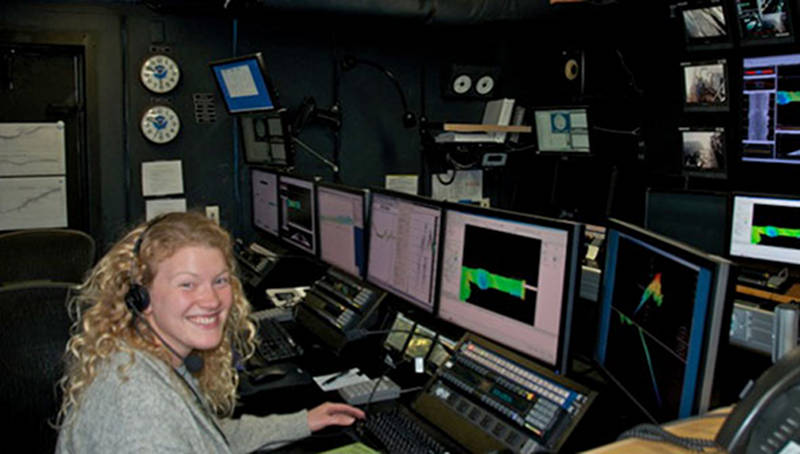 Marah Dahn gets hands-on seafloor mapping experience in the control room of NOAA Ship Okeanos Explorer.