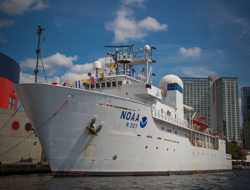 NOAA Ship Okeanos Explorer tied up to the pier, preparing for departure.