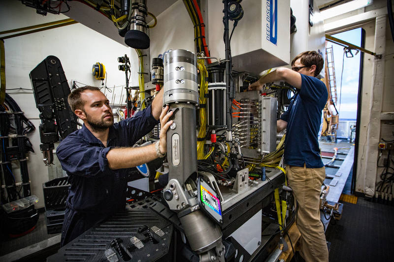 ROV Engineers, Jeff Laning and Bobby Mohr make final adjustments before a dive. 