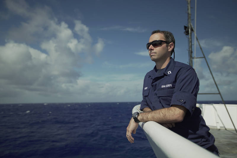 LT Brian Kennedy, expedition coordinator for this leg, breathes a sign of relief and enjoys the view as the ship is finally underway.