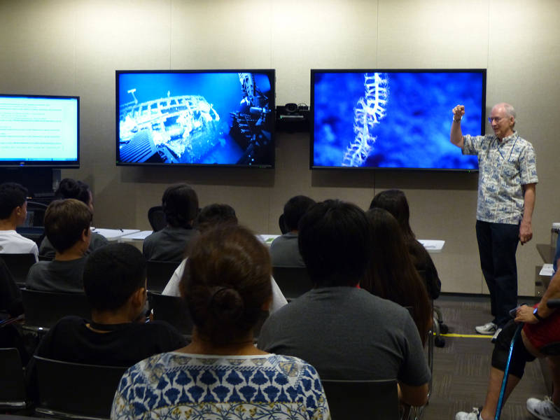 When functioning properly, telepresence can be an amazing outreach tool. Here, Bruce Mundy talks to a group of students from a local Honolulu school visiting the Inouye Regional Center about the expedition and what lies in the unexplored deep sea right in their backyard.