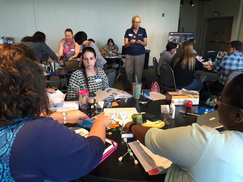 Teachers attend a professional development workshop in New Orleans to learn how to implement lesson plans in their classrooms.