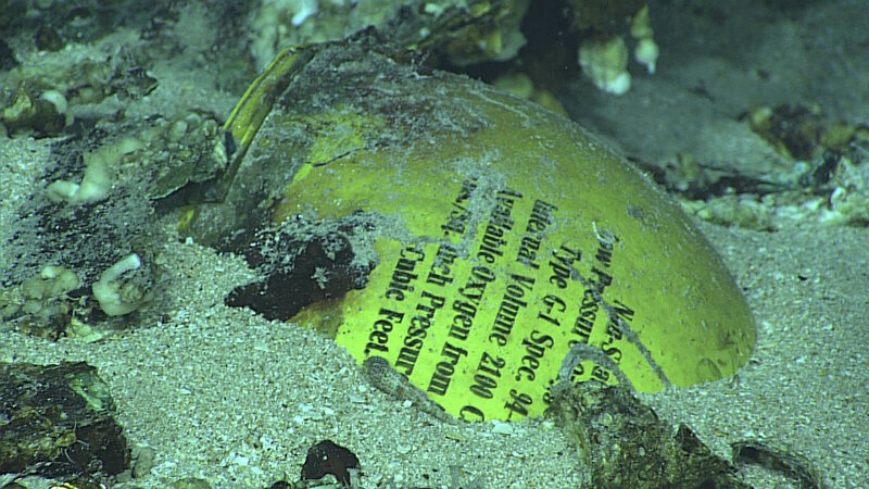 This yellow tank is an oxygen cylinder used in the system to pressurize the crew’s cabin spaces. It is in remarkably good condition with the writing still legible.