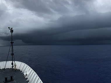 The second squall line approaches the Okeanos Explorer just before the remotely operated vehicles reach the bottom.