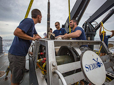 The Global Foundation for Ocean Exploration ROV team finish up their post-dive check list.