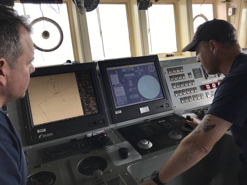 The Operations Officer on the bridge interacts with the ROV navigator, positioning the ship as required.