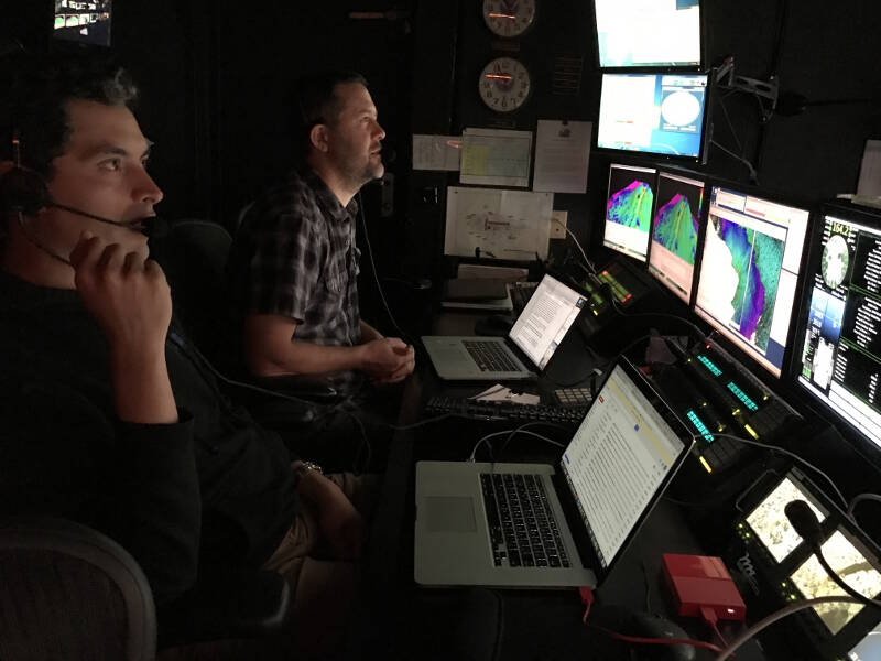 The onboard scientists (“watch leads”) sitting in the back row of the Control Room, narrating the dive.