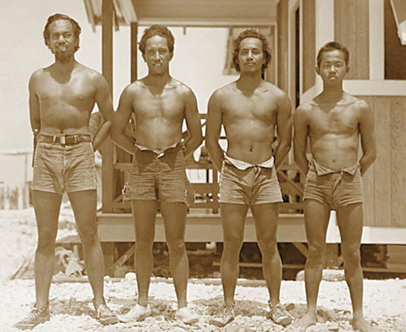 'Hawaiian Colonists—American Citizens. Kamehameha School Graduates.' These words inspired the title of the 2002 Bishop Museum exhibit. Left to right, Solo-mon Kalama, Charles Ahia, Jacob Haili, and Harold Chin Lum, on Jarvis, 1937. Lum was not a K.S. graduate.