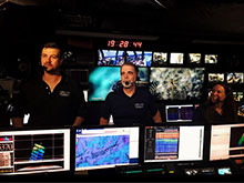 Geology Lead Scientist, Dr. Del Bohnenstiehl (left), and Biology Science Lead, Dr. Scott France (middle), answer questions during the first-ever NOAA Ship Okeanos Explorer Facebook Live interaction. Web coordinator, Amy Bowman (right) helped field questions from the public during this exchange. Geology Lead Scientist, Dr. Del Bohnenstiehl (left), and Biology Science Lead, Dr. Scott France (middle), answer questions during the first-ever NOAA Ship Okeanos Explorer Facebook Live interaction. Web coordinator, Amy Bowman (right) helped field questions from the public during this exchange.