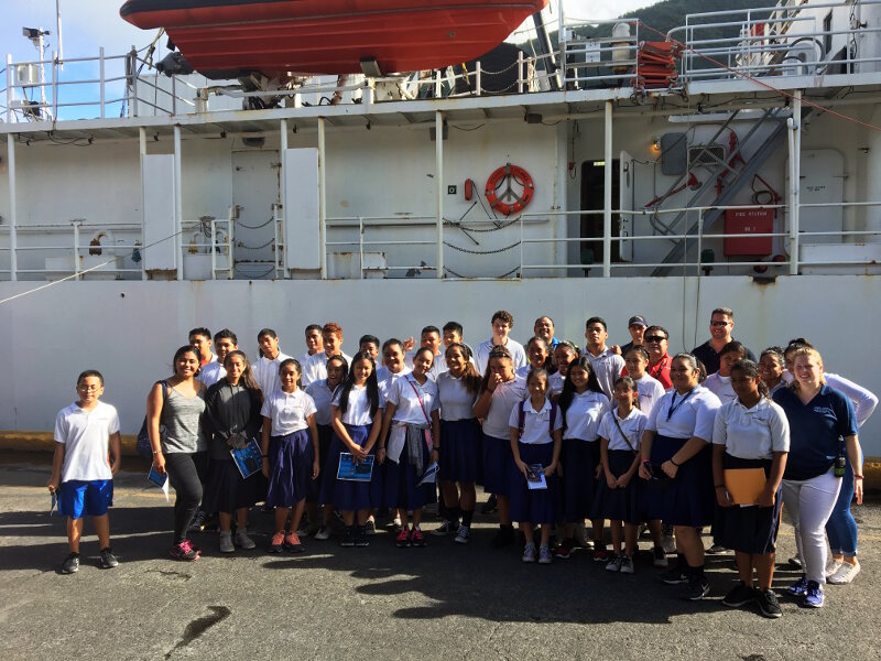 Students from American Samoa tour NOAA Ship Okeanos Explorer. Seen on the far right of the second row is Expedition Coordinator, Kasey Cantwell, and on the far right of the last row is mapping lead, Mike White.