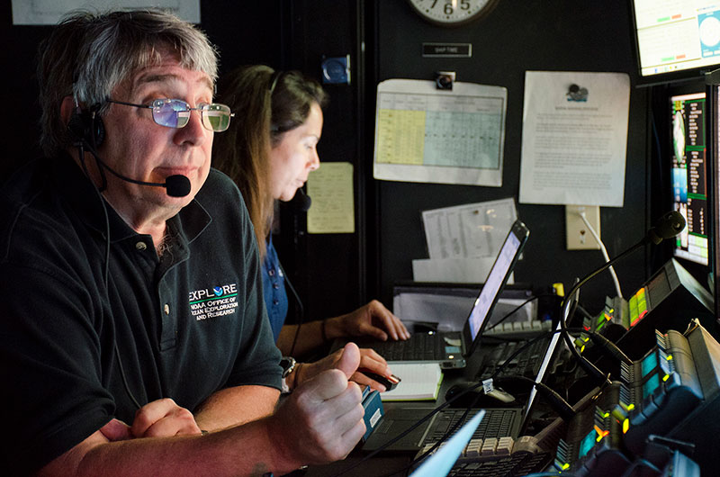 Science co-lead, Chris Kelley, and NOAA Educational Partnership Program Intern, Nikola Rodriguez, are hard at work in the control room aboard NOAA Ship Okeanos Explorer. 