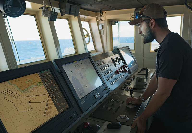 Kongsberg DP Technician, Michael Neal, verifies input signals to the ship's dynamic positioning system after upgrades were made during the ship's dry dock period.