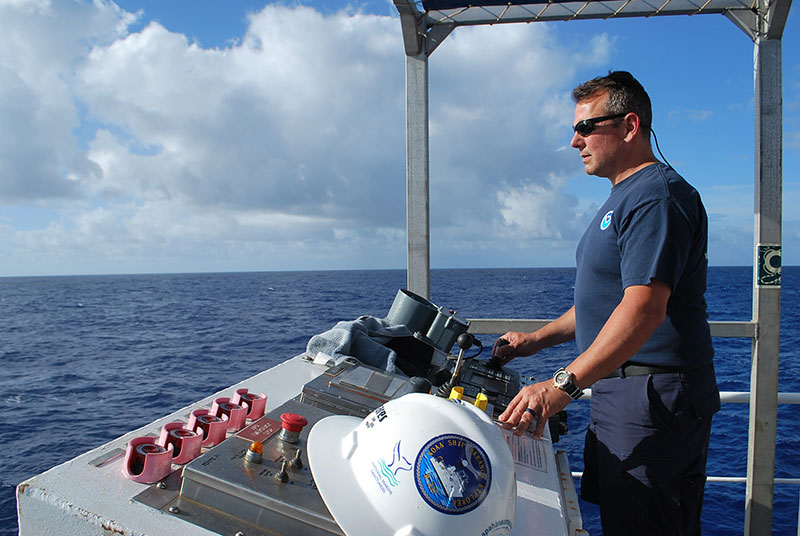 CDR Eric Johnson oversees deployment of the CTD rosette during a shakedown cruise on NOAA Ship Okeanos Explorer.
