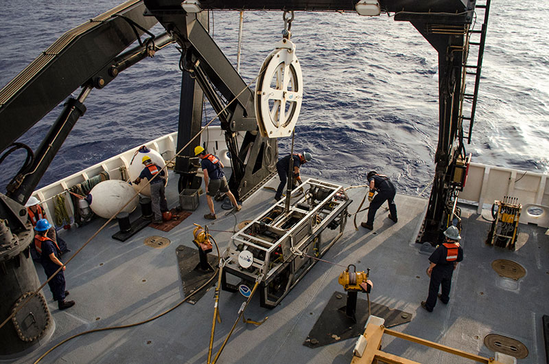 AB James Scott secures remotely operated vehicle Seirios on the deck of NOAA Ship Okeanos Explorer.