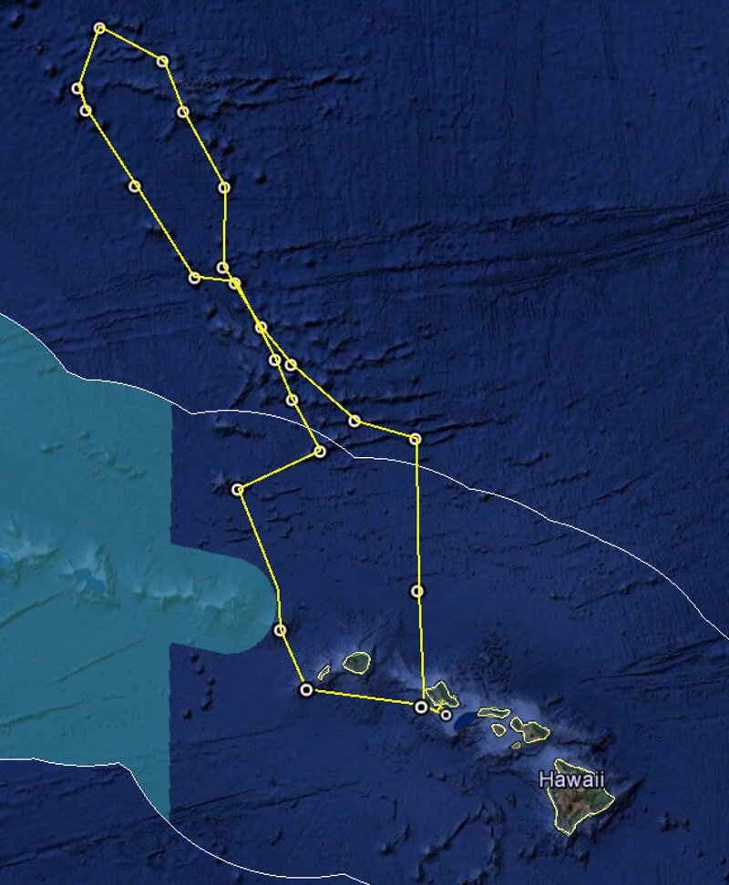 Map of the general expedition operating area. The yellow line is the rough cruise track through the Musicians Seamounts during the Deep-Sea Symphony expedition. The green polygon represents the boundary of the Papahānaumokuākea Marine National Monument. The white line represents the U.S. exclusive economic zone. Planned ROV dives are represented by white circles. Twenty-three ROV dives are expected during this expedition.