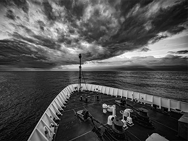 The calm before the storm: The cold front passes over the ship.