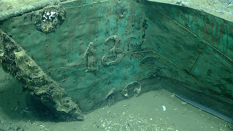 Lead draft marks on the wreck's stem post at what appeared to be one-foot intervals suggest that a significant portion of the hull remains buried under sediment.