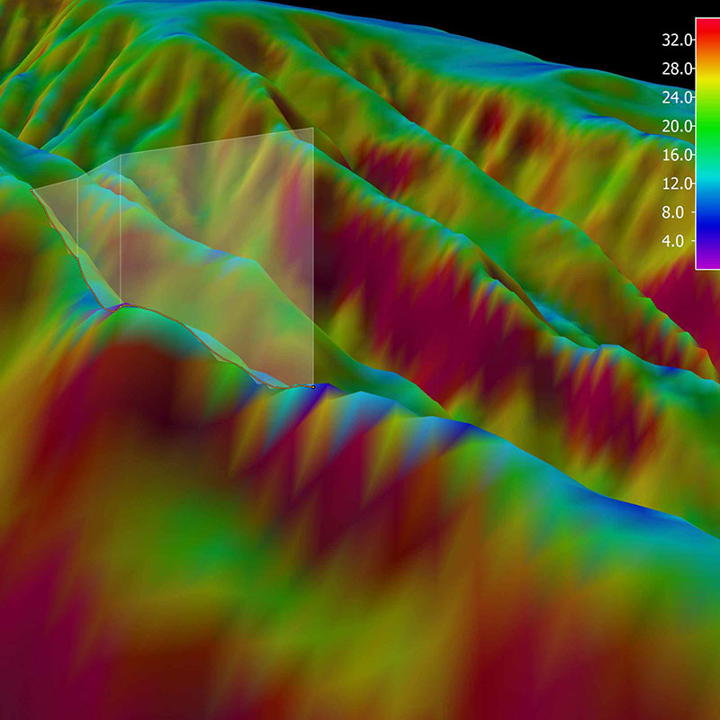 3D view of the planned ROV track for Dive 11 shown as orange line with white curtain protruding from the slope. The background represents the seafloor depth color-coded with slope in degrees. The warmer the color, the steeper the slope. 