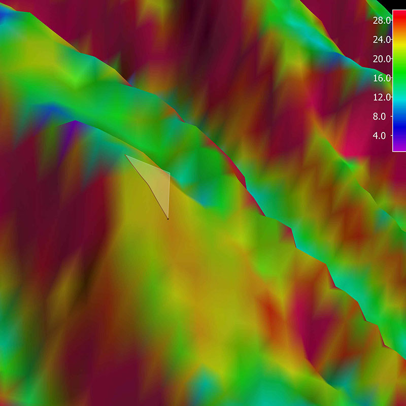 3D view of the planned ROV track for Dive 12 shown as orange line with white curtain protruding from the slope. The background represents the seafloor depth color-coded with slope in degrees. The warmer the color, the steeper the slope. 