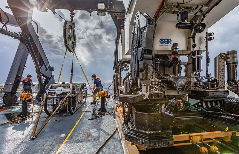 The team preps for the first remotely operated vehicle (ROV) dive of the mission on a cloudy morning.