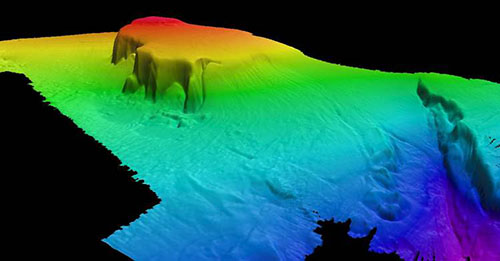 During the expedition, the team collected multibeam bathymetry of Engaño Canyon and Engaño Bank; this area within the Dominican Republic had never been previously mapped with multibeam surveys. The data reveals a plateau area with depths as shallow as 80 meters (262 feet), distinct sand waves, and the head of a gently sloping canyon system with steep walls on the north side of the feature.