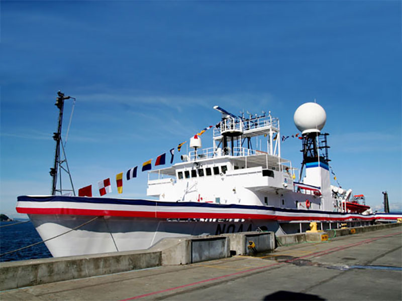 NOAA Ship Okeanos Explorer, in full dress for her 2008 Commissioning Ceremony, celebrates her 100th exploration expedition June 20 - July 12, 2019.