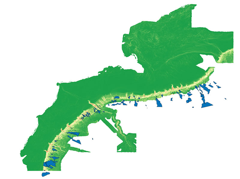 Submarine landslide locations (blue polygons) in Northeastern U.S. Atlantic waters displayed over a map of seafloor slope (green is gently sloping, red is steeply sloping). Landslides were mapped by Jason Chaytor, U.S. Geological Survey. Landslides generally occur on steep slopes at the shelf edge, sometimes within submarine canyons. Documented landslide locations are used as observations for predictive modeling, and seafloor slope is a highly correlated predictor.