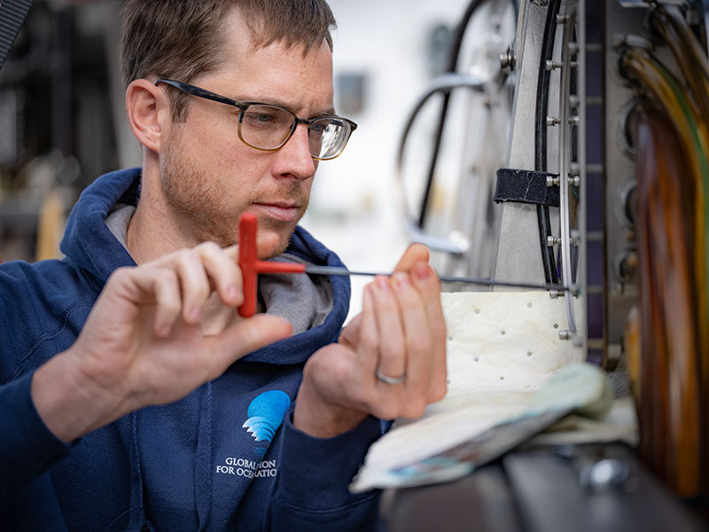 Global Foundation for Ocean Exploration Systems/Robotics Engineer Bobby Mohr. The ROV team took advantage of the unexpected in port by conducting routine maintenance on their equipment.