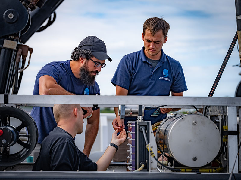 Global Foundation for Ocean Exploration Engineers Sean Kennison, Levi Unema, and Dan Rogers. The ROV team took advantage of the unexpected in port by conducting routine maintenance on the remotely operated vehicles.