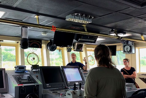 Operations Officer Lieutenant Rosemary Abbitt gives a tour of the bridge of NOAA Ship Okeanos Explorer  during the August 23, 2019 ship tours in Dartmouth, Nova Scotia.