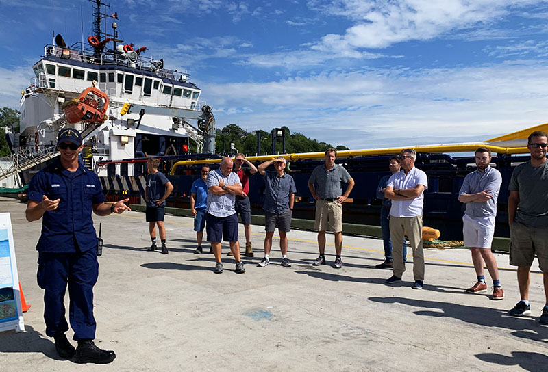 NOAA Corps Ensign Nicolas Osborn welcomes guests to NOAA Ship Okeanos Explorer at the beginning of the ship tours held in Dartmouth, Nova Scotia.